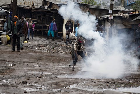Opposition supporters clash with police in Kibera slum in Nairobi. (Photo | AP)