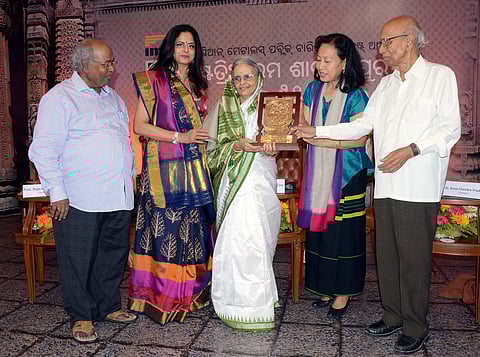 Sarala Puraskar being presented to Odia writer Banaja Devi by Mamang Dai in Bhubaneswar on Thursday. Also seen is trustee of IMFA Charitable Trust Paramita Mahapatra | Express