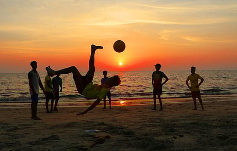 Representational image: Students playing football at Buttroad beach in Kozhikode as the football fever grips the city during the FIFA Under-17 World Cup.