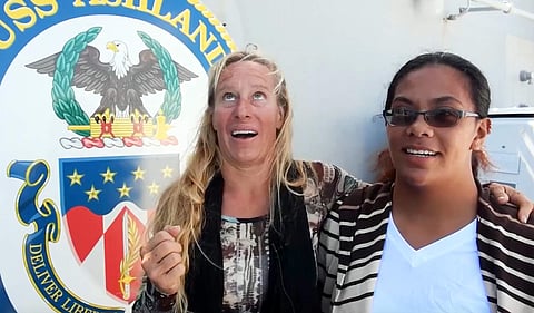 Jennifer Appel, left, and Tasha Fuiava, who with their dogs were rescued after being lost at sea for several months. | AP
