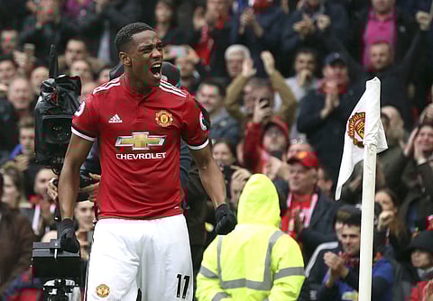 Manchester United's Anthony Martial celebrates scoring his side's first goal of the game during the English Premier League soccer match between Manchester United and Tottenham Hotspur, at Old Trafford, in Manchester. | AP