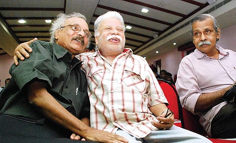 Sharing camaraderie: Punathil Kunjabdulla with writer M Mukundan and poet Kalpetta Narayanan during an award function in Kozhikode