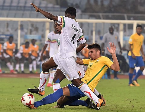 Brazil forward Yuri Alberto 19 being tackled down by Mali defenders during FIFA U-17 World cup third place deciding match in Kolkata on Saturday. | PTI