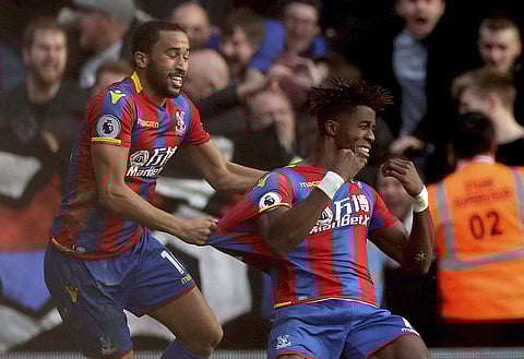 Crystal Palace's Wilfried Zaha, right, celebrates scoring his side's second goal of the game, during the English Premier League soccer match between Crystal Palace and West Ham United, at Selhurst Park, in London, Saturday Oct. 28, 2017. | AP