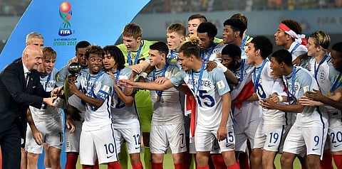 England players receive the winning trophy from FIFA President Gianni Infantino L during FIFA U-17 World Cup 2017 final match in Kolkata on Saturday. | PTI