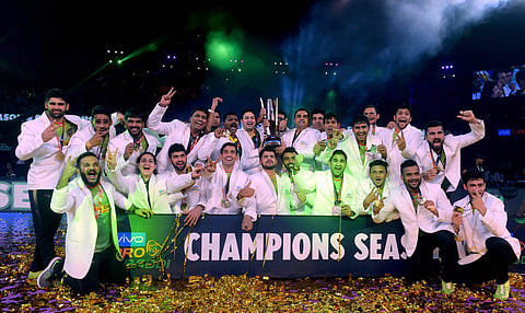 Captain of Patna Pirates Pardeep Narwal L and his team members celebrate with trophy after win over Gujarat Fortunegiants at their Pro Kabaddi Final match at Nehru Indoor Stadium in Chennai on Saturday.(Photo | PTI)