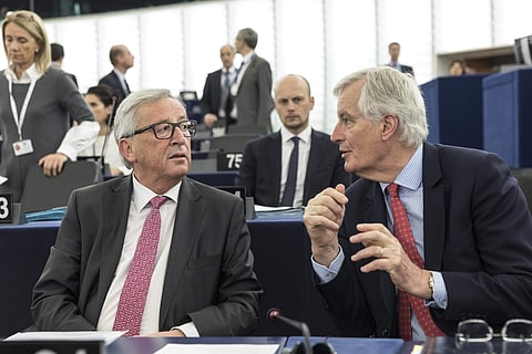 European Union chief Brexit negotiator, Michel Barnier speaks with President of the European Commission Jean-Claude Juncker. (Photo | AP)