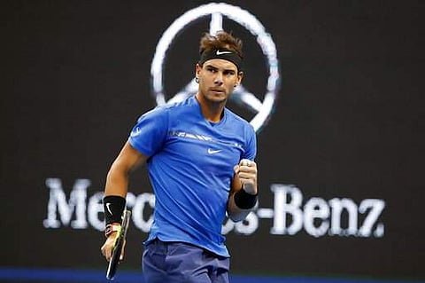 Rafael Nadal reacts after scoring a point against Lucas Pouille during men's singles match in the China Open tennis tournament at the Diamond Court in Beijing. | AP