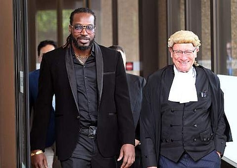 West Indies cricketer Chris Gayle leaves the New South Wales Supreme Court in Sydney on October 25, 2017. | AFP