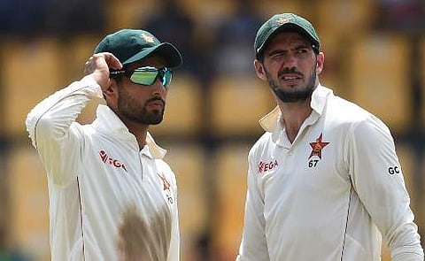 Zimbabwe's cricket captain Graeme Cremer (R) with Sikandar Raza | (File | AFP)