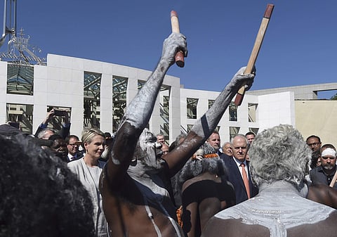 In this Nov. 28, 2016 file photo, Australia's Prime Minister Malcolm Turnbull observes an aboriginal dance during an event against domestic violence outside Parliament House in Canberra. (Photo | Associated Press)