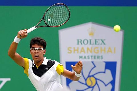 Chung Hyeon of South Korea watches his shot as he plays against Roberto Bautista Agut of Spain during their men's singles match of the Shanghai Masters tennis tournament. | AP