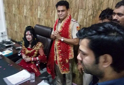Radhe Maa sitting on SHO's chair at Vovek Vihar police station in East Delhi. (ANI)