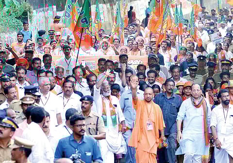 Uttar Pradesh Chief Minister Yogi Adityanath walks along with BJP state president Kummanam Rajasekharan in the Janaraksha Yathra on Wednesday from Keecheri to Kannur. BJP leaders V Muraleedharan,  P K Krishnadas, national general secretary Arun Singh and 