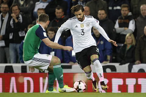 Germany's Marvin Plattenhardt, 3, runs with the ball during the World Cup Group C qualifying soccer match between Northern Ireland and Germany at Windsor Park in Belfast, Northern Ireland. | AP
