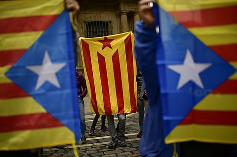 Pro independence supporters hold up ''esteleda'' or Catalan pro independence flags. (Photo | AP)