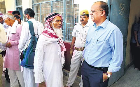 Brajesh Narain Singh (right) with a visitor