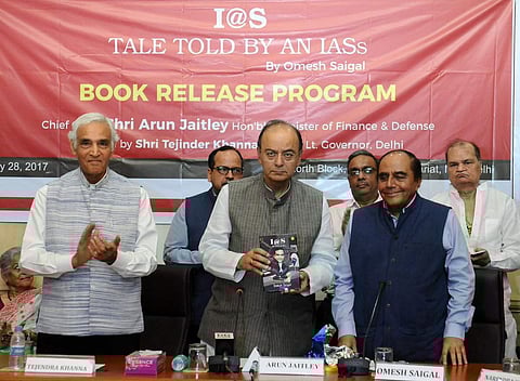 FM  Arun  Jaitley releasing a book entitled “I@S – TALE TOLD BY AN IASs” by a former IAS officer Omesh Saigal, in New Delhi. (Image courtesy Twitter @FinMinIndia)