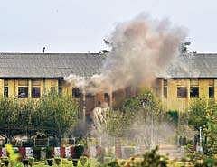 Smoke billows out of a building where militants were believed to be hiding during an encounter with security forces, following an attack on a BSF camp, near the airport in Srinagar last week | PTI Photo