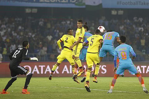 India's Jackson Singh Thounaojam and others jump for a header during their FIFA U-17 World Cup against Colombia in New Delhi on Oct. 9, 2017. (Photo | AP)