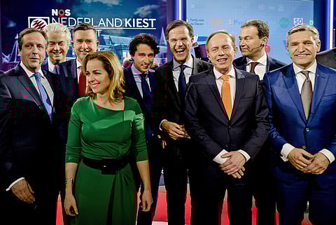 In this Tuesday March 14, 2017, file photo Democrats 66 party leader Alexander Pechtold, right-wing populist leader Geert Wilders, Socialist Party leader Emile Roemer, Party for the Animals' Marianne Thieme, Green Left party leader Jesse Klaver, Dutch Pri