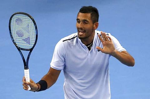 Nick Kyrgios talks to the umpire during his men's singles championship match against Rafael Nadal in the China Open in Beijing. | AP