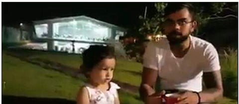 Virat kohli with MS Dhoni’s daughter Ziva. | Twitter