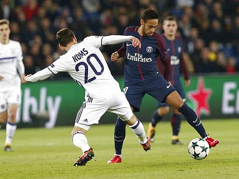 Anderlecht's Sven Kums, left, and PSG's Neymar battle for the ball during a Champions League Group B soccer match between Paris Saint-Germain and Anderlecht at Parc des Princes stadium in Paris. | AP