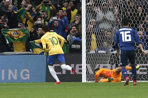 Brazil's Neymar celebrates after scoring his side's opening goal during their international friendly against Japan | AFP