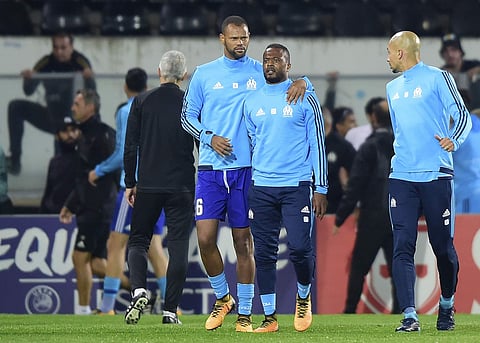 Patrice Evra being led away after the scuffle (File| AP)