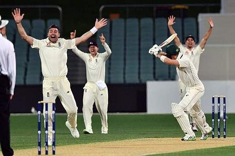 England's paceman James Anderson (L) and teammates shout for a leg-before-wicket appeal against Cricket Australia XI's batsman Nick Larkin on the third day of a four-day Ashes tour match at the Adelaide Oval in Adelaide on November 10, 2017. | AFP