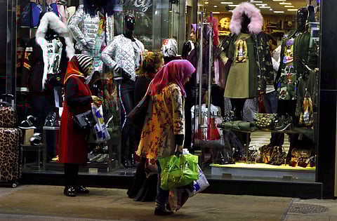 Iraqi tourists outside a shop in Hamra street in Beirut. Hariri’s shock resignation could unravel the first steps in years toward injecting some cash and confidence in Lebanon’s anemic economy. | AP