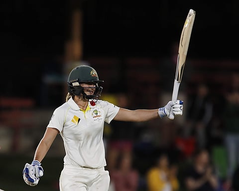 Australia's Ellyse Perry raises her bat after scoring 200 runs during day 3 of the Women's Ashes Test. | AP