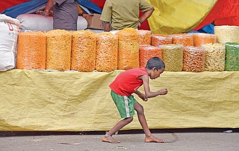 A child at Kadalekai Parishe, the annual groundnut festival at Basavanagudi in Bengaluru, on Saturday | nagaraja gadekal