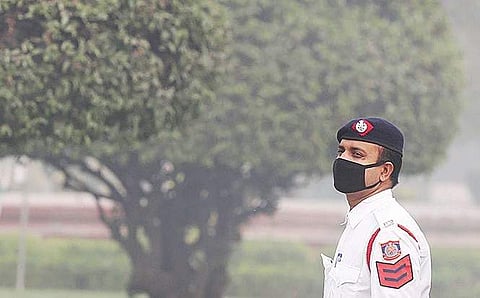 A traffic policeman wears a protective mask in Delhi on Monday | Shekhar Yadav