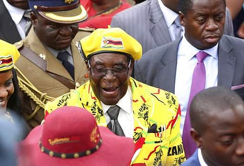 Zimbabwean President Robert Mugabe, centre, arrives for a solidarity rally in Harare. |AP