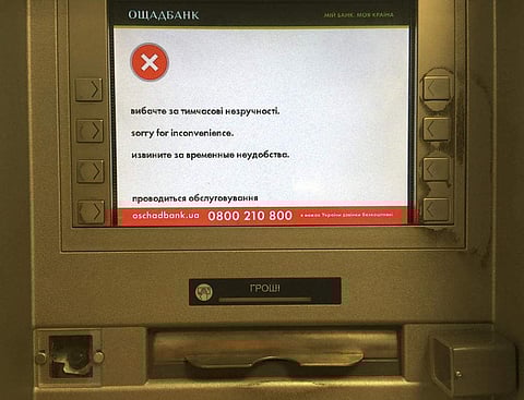 A screen of an idle virus affected cash machine in a state-run OshchadBank says 'Sorry for inconvenience/Under repair' in Kiev, Ukraine, Wednesday, June 28, 2017. (Photo | Associated Press)