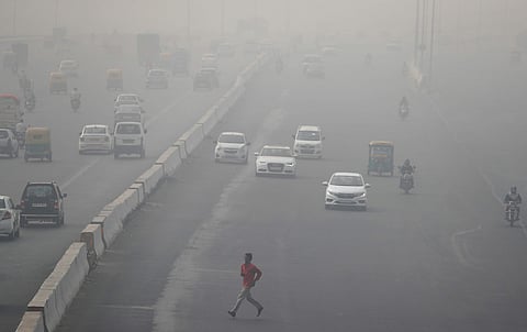 An expressway cloaked in smog near Delhi. (Reuters)