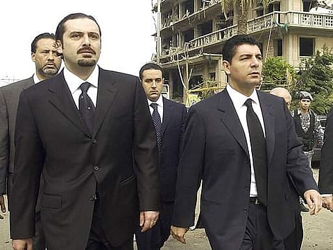 Bahaa Hariri, right, and Saad Hariri, sons of slain Lebanese former Prime Minister Rafik Hariri, visit the scene where their father was assassinated in Beirut.|AP