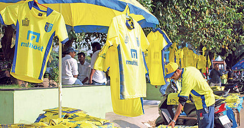 Roadside vendors selling Kerala Blasters FC's yellow kits ahead of the Indian Super League  opener between the home team and ATK near the Jawaharlal Nehru International Stadium premises  in Kochi on Thursday |  K Shijith
