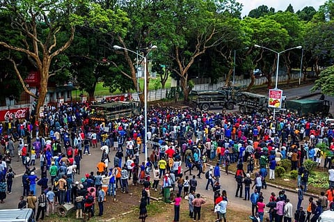 Thousands of Zimbabweans walk towards the State House, during a demonstration to demand the resignation of Zimbabwe's president on November 18, 2017 in Harare.|AFP