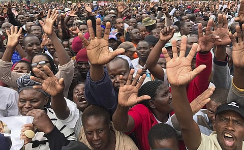 People gather to demonstrate for the ouster of 93-year-old President Robert Mugabe who is virtually powerless and deserted by most of his allies. (Photo | AP)