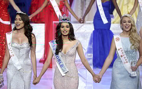 India's Manushi Chillar center is crowned Miss World during the beauty pageant held in Sanya in southern China's Hainan province on Saturday Nov. 18 2017. | AP