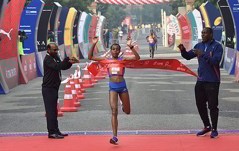Ethiopia's Almaz Ayana crosses the finishing line to win the women s Airtel Delhi Half Marathon 2017 | AP