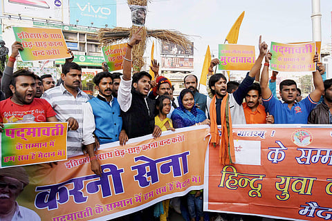 Activists of Rashtriya Rajput Karni Sena Jharkhand wing hold placards demanding the ban on screening of upcoming Bollywood movie 'Padmavati' in Ranchi on Saturday. | PTI