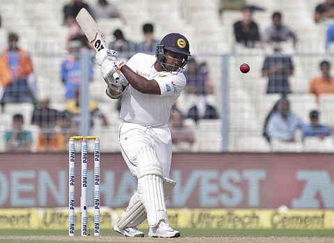 Sri Lanka's Rangana Herath plays a shot during the fourth day of their first test cricket match against India in Kolkata. | AP
