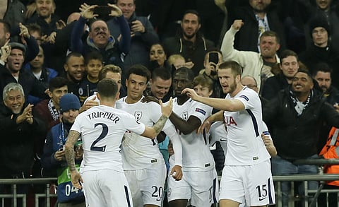 Tottenham's Dele Alli, third from left, celebrates with his teammates after scoring his side's opening goal during a Champions League Group H soccer match between Tottenham Hotspurs and Real Madrid at the Wembley stadium in London, Wednesday, Nov. 1, 2017. | AP