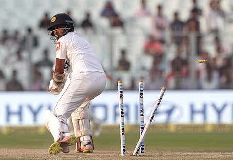 Sri Lanka's captain Dinesh Chandimal is bowled out by India's Mohammed Shami during the fifth day of their first test cricket match | AP