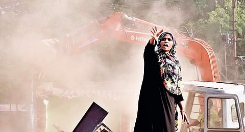 A woman protests GHMC demolition at Ambedkar Colony, in Hyderabad on Monday | Vinay madapu