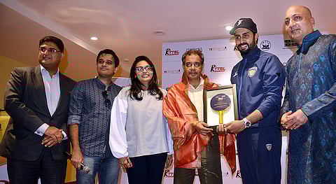 Bollywood star Abhishek Bachchan (second right) presenting a momento to former player V Chandrasekhar during the unveiling of TTSL Trophy. | D Sampathkumar
